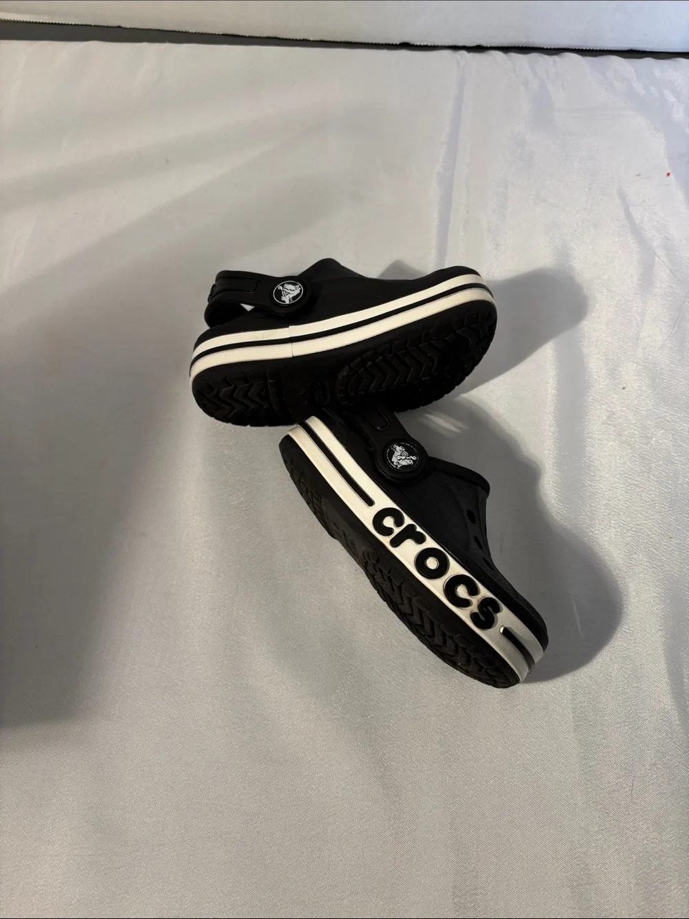 CROCS Kids Black Clogs with White Stripe